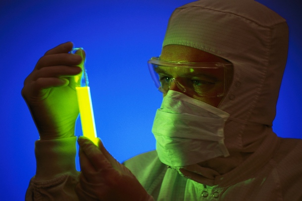 Scientist Holding Glowing Chemical